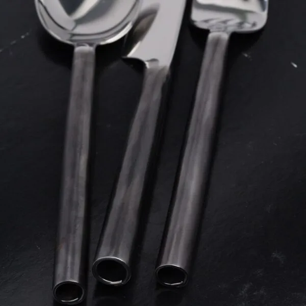 Handcrafted unpolished rolled handle flatware set by Thai artisans